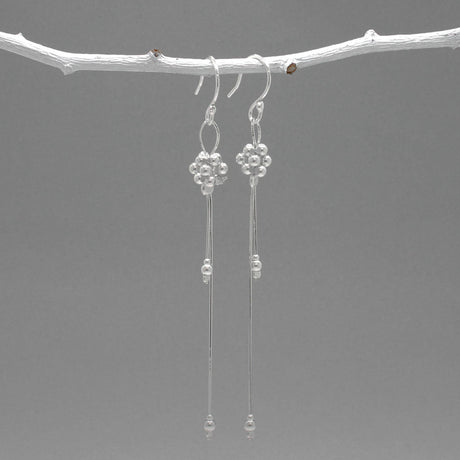 The Áine – Beaded Cluster Double Chain Silver Dangle Earrings feature a delicate arrangement of silver beads in a clustered design, suspended from double fine chains for graceful movement. Crafted in solid .925 sterling silver, these lightweight earrings are a beautiful mix of texture and flow, perfect for day-to-evening wear.