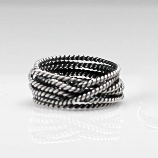 Aran - Twisted Lasso Oxidised Silver Ring. Inspired by the intricate twists of lasso rope designs, this piece adds a unique flair to your style.  Crafted from oxidized sterling silver and featuring a comfortable 7mm band width, it's ideal for wearing alone or stacking with other rings for a bold statement.&nbsp;