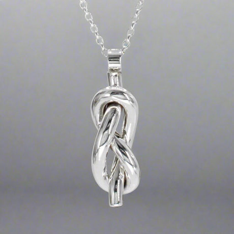 Aran - Single Open Knot Silver Pendant Ireland Jewellery West Cork
Inspired by timeless nautical knots. This sculpted pendant is handcrafted in solid sterling silver. Its open knot design, combined with a highly polished finish, makes it a versatile piece for daily wear or special occasions. Perfect Christmas Gift
Details:
* Material: Handmade solid sterling silver
* Dimensions: 12mm wide x 34mm high (from the top of the bail) x 8mm thick (approx. 1/2" x 1 3/8" x 5/16")