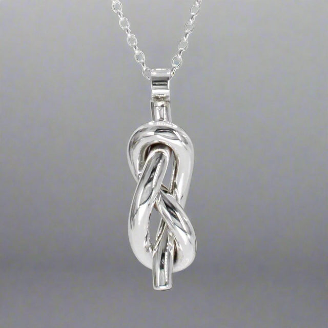 Aran - Single Open Knot Silver Pendant Ireland Jewellery West Cork
Inspired by timeless nautical knots. This sculpted pendant is handcrafted in solid sterling silver. Its open knot design, combined with a highly polished finish, makes it a versatile piece for daily wear or special occasions. Perfect Christmas Gift
Details:
* Material: Handmade solid sterling silver
* Dimensions: 12mm wide x 34mm high (from the top of the bail) x 8mm thick (approx. 1/2" x 1 3/8" x 5/16")