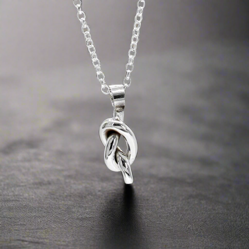 Aran - Small Single Knot Pendant Ireland Jewellery
This delicate handmade pendant is crafted from sterling silver, featuring a timeless single knot design symbolising unity and connection. Compact and elegant, it’s perfect for everyday wear or as a meaningful gift.
Details:
* Material: Handmade sterling silver