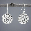The Camila Disc Oxidised Silver Earrings feature a simple yet stylish design, crafted from .950 sterling silver with an oxidized finish. These versatile dangle earrings are perfect for adding a touch of understated elegance.
Material: .950 sterling silver with an oxidized finish
Dimensions:
Diameter: 16mm (5/8 inches)
Length: 32mm (1 1/4 inches) from the top of the ear wire
Design: Dangle style with sterling silver French wire
A minimalist piece with a modern oxidized finish, perfect for any occasion.