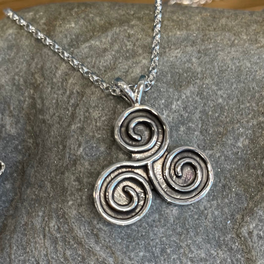 This stunning Celtic - Triskel Oxidised Silver Pendant measures 21 mm wide and 24 mm from the top of the bail. Included is a 1.7 mm Sterling Silver Rolo Chain with a round spring clasp for easy wear.