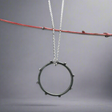 Make a statement with the Firmament - Aloe - Oxidised Circle with Dots Silver Pendant. This striking pendant, crafted from .925 sterling silver, features a unique dotted design in a circle shape with an oxidised and high-polished finish, adding depth and texture to the piece. A perfect gift or a treat for yourself, this pendant brings a touch of artistry to any look.