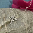 Celtic Knot Cross Silver Pendant Dimensions: 16mm wide by 25mm from the top of the bail Material: .950 sterling silver with a high polished finish and light oxidization Chain: 1.4mm sterling silver belcher rolo chain with a spring clasp Length: Select your preferred chain length below A timeless piece that beautifully captures the spirit of Celtic tradition.