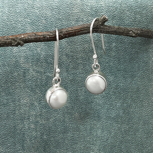 Pearla - Mounted White Pearl Silver Earrings - Dangle Curated and designed by Emilio Sotelo Jewelry for Croi Kinsale Jewellery in Kinsale West Cork Ireland Europe. Find exceptional handmade silver and gold jewellery at affordable prices for birthday gifts and Christmas presents. Handcrafted Silver jewelry. Find the best affordable jewellery