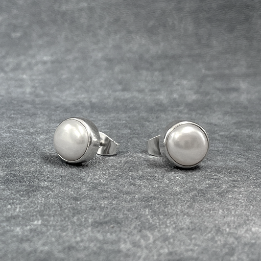 Pearla - Mounted White Pearl Silver Earrings - Stud Curated and designed by Emilio Sotelo Jewelry for Croi Kinsale Jewellery in Kinsale West Cork Ireland Europe. Find exceptional handmade silver and gold jewellery at affordable prices for birthday gifts and Christmas presents. Handcrafted Silver jewelry. Find the best affordable jewellery