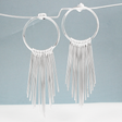 Saha - RADA Cascade Long Hoop Silver Earrings - Stud. These earrings command attention with their impressive dimensions: the hoop measures 28mm in diameter by 1.5mm thick, or roughly 1 1/16 inches by 1/16 inches thick. Extending gracefully at 75mm from the top of the ear wire, they make a striking statement.