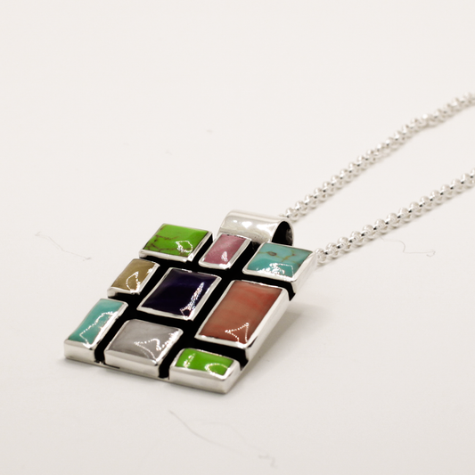 Sleveen - Square With Multi-Coloured Mosaic Resin Silver Pendant Curated and designed by Emilio Sotelo Jewelry for Croi Kinsale Jewellery in Kinsale West Cork Ireland Europe. Find exceptional handmade silver and gold jewellery at affordable prices for birthday gifts and Christmas presents. Find Irish designers and makers. Beautiful jewellery shop located in Kinsale, Co. Cork.
