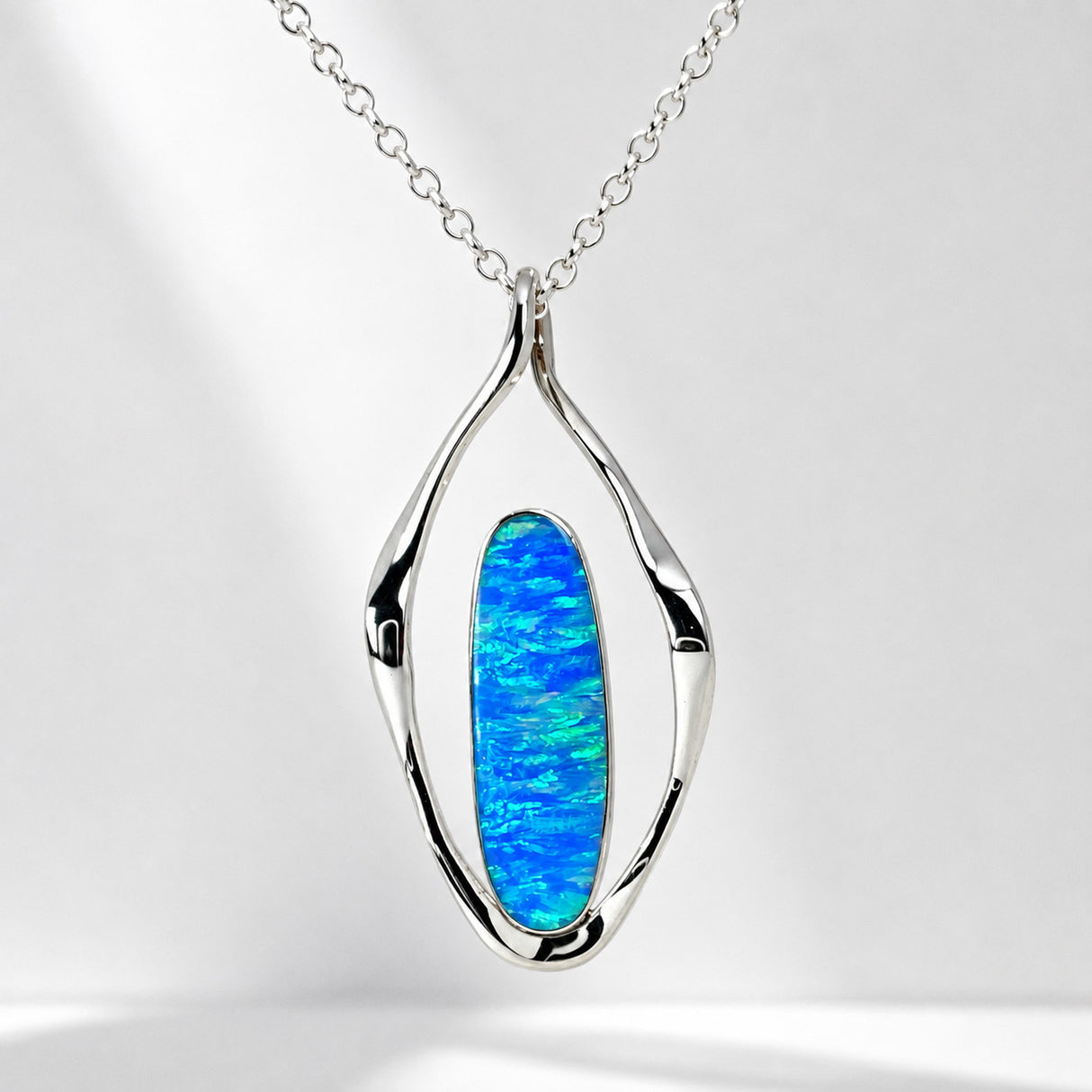 Tara Blue Opalescent Oblong in Flame-Shaped Framed Silver Pendant