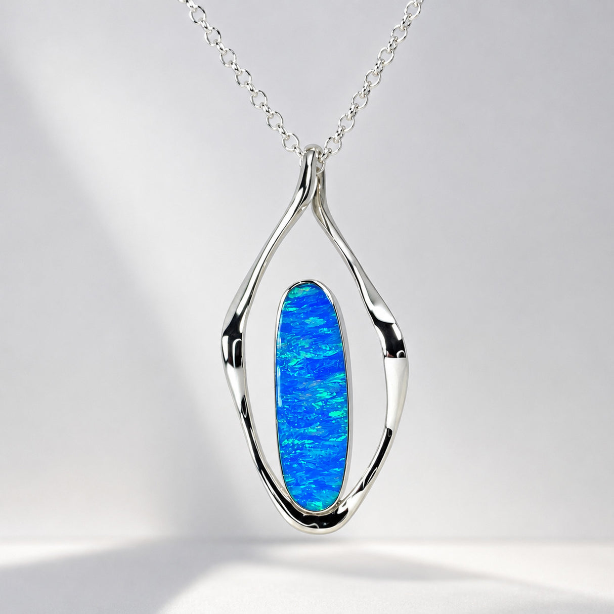 Tara Blue Opalescent Oblong in Flame-Shaped Framed Silver Pendant
