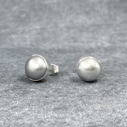 Pearla - Mounted Gray Pearl Silver Earrings - Stud Curated and designed by Emilio Sotelo Jewelry for Croi Kinsale Jewellery in Kinsale West Cork Ireland Europe. Find exceptional handmade silver and gold jewellery at affordable prices for birthday gifts and Christmas presents. Handcrafted Silver jewelry. Find the best affordable jewellery