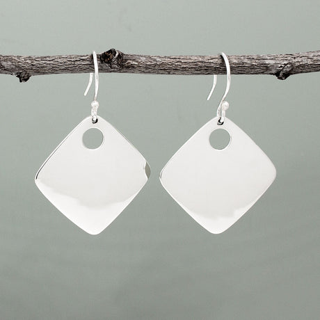 Nathalia - Rhombus Off-Center Dot Silver Earrings. With dimensions of 29mm long by 29mm wide, or roughly 1 1/4 inches square, they make a bold yet elegant statement. The off-center dot design adds a unique flair to their high polished finish.
