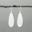 Nathalia - Drop Large Silver Earrings - Dangle. Crafted from .950 sterling silver with a high polished finish, these earrings boast dimensions of 14mm at their widest and 1.5mm at their narrowest. With a length of 37mm and 52mm from the top of the French wire, they sway gracefully. Perfect for any occasion.