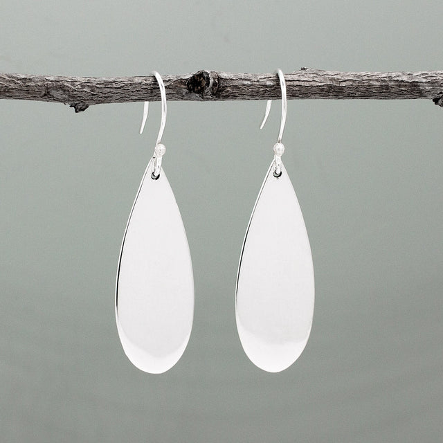 Nathalia - Drop Large Silver Earrings - Dangle. Crafted from .950 sterling silver with a high polished finish, these earrings boast dimensions of 14mm at their widest and 1.5mm at their narrowest. With a length of 37mm and 52mm from the top of the French wire, they sway gracefully. Perfect for any occasion.