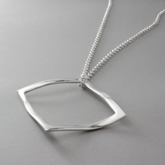 AYA - Outer Square Silver Pendant Curated and designed by Emilio Sotelo Jewelry for Croi Kinsale Jewellery in Kinsale West Cork Ireland Europe. Find exceptional handmade silver and gold jewellery at affordable prices for birthday gifts and Christmas presents. Find Irish designers and makers. Beautiful jewellery shop located in Kinsale, Co. Cork.