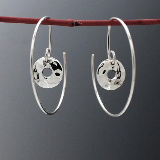 Artemis - Small Off-Center Disc Hammered Reverse Hoop Silver Earrings Curated and designed by Emilio Sotelo Jewelry for Croi Kinsale Jewellery in Kinsale West Cork Ireland Europe. Find exceptional handmade silver and gold jewellery at affordable prices for birthday gifts and Christmas presents. Handcrafted Silver jewelry. The best affordable jewellery