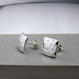 Artemis - Small Square Hammered Silver Earrings - Stud Curated and designed by Emilio Sotelo Jewelry for Croi Kinsale Jewellery in Kinsale West Cork Ireland Europe. Find exceptional handmade silver and gold jewellery at affordable prices for birthday gifts and Christmas presents. Handcrafted Silver jewelry. Find the best affordable jewellery
