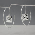 Artemis - Small Square Hammered Reverse Hoop Silver Earrings Curated and designed by Emilio Sotelo Jewelry for Croi Kinsale Jewellery in Kinsale West Cork Ireland Europe. Find exceptional handmade silver and gold jewellery at affordable prices for birthday gifts and Christmas presents. Handcrafted Silver jewelry. The best affordable jewellery