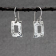 Artemis - Small Off-Center Rectangle Hammered Silver Earrings - Dangle Curated and designed by Emilio Sotelo Jewelry for Croi Kinsale Jewellery in Kinsale West Cork Ireland Europe. Find exceptional handmade silver and gold jewellery at affordable prices for birthday gifts and Christmas presents. Handcrafted Silver jewelry. Find the best affordable jewellery