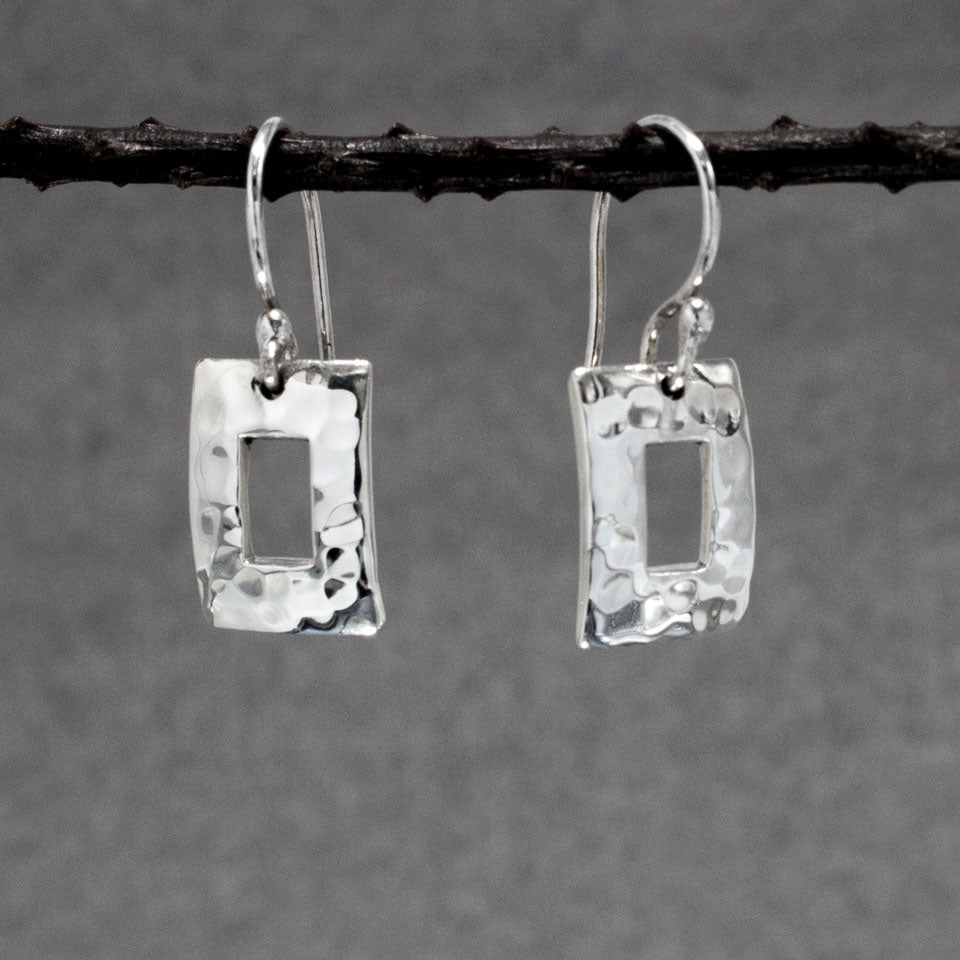 Artemis - Small Off-Center Rectangle Hammered Silver Earrings - Dangle Curated and designed by Emilio Sotelo Jewelry for Croi Kinsale Jewellery in Kinsale West Cork Ireland Europe. Find exceptional handmade silver and gold jewellery at affordable prices for birthday gifts and Christmas presents. Handcrafted Silver jewelry. Find the best affordable jewellery