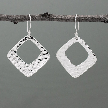 At 29mm x 29mm in size, featuring a 1 1/4 inch length and width, and a 1 11/16 inch drop from the ear wire, these Nathalia's Rhombus With Off-Center Hammered Silver Earrings - Dangle are made of .950 sterling silver with a stunning hammered finish. With sterling silver French wire.