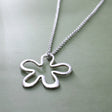 Moineir - Daisy Silhouette Silver Pendant Curated and designed by Emilio Sotelo Jewelry for Croi Kinsale Jewellery in Kinsale West Cork Ireland Europe. Find exceptional handmade silver and gold jewellery at affordable prices for birthday gifts and Christmas presents. Find Irish designers and makers. Beautiful jewellery shop located in Kinsale, Co. Cork.