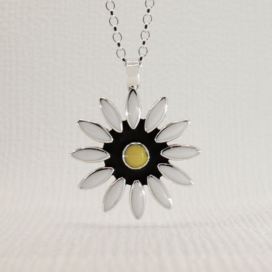 Sleveen - White Resin Daisy Silver Pendant Curated and designed by Emilio Sotelo Jewelry for Croi Kinsale Jewellery in Kinsale West Cork Ireland Europe. Find exceptional handmade silver and gold jewellery at affordable prices for birthday gifts and Christmas presents. Find Irish designers and makers. Beautiful jewellery shop located in Kinsale, Co. Cork.