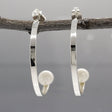 Artemis - Half Hoop Pearl Silver Earrings - Stud Curated and designed by Emilio Sotelo Jewelry for Croi Kinsale Jewellery in Kinsale West Cork Ireland Europe. Find exceptional handmade silver and gold jewellery at affordable prices for birthday gifts and Christmas presents. Handcrafted Silver jewelry. Find the best affordable jewellery