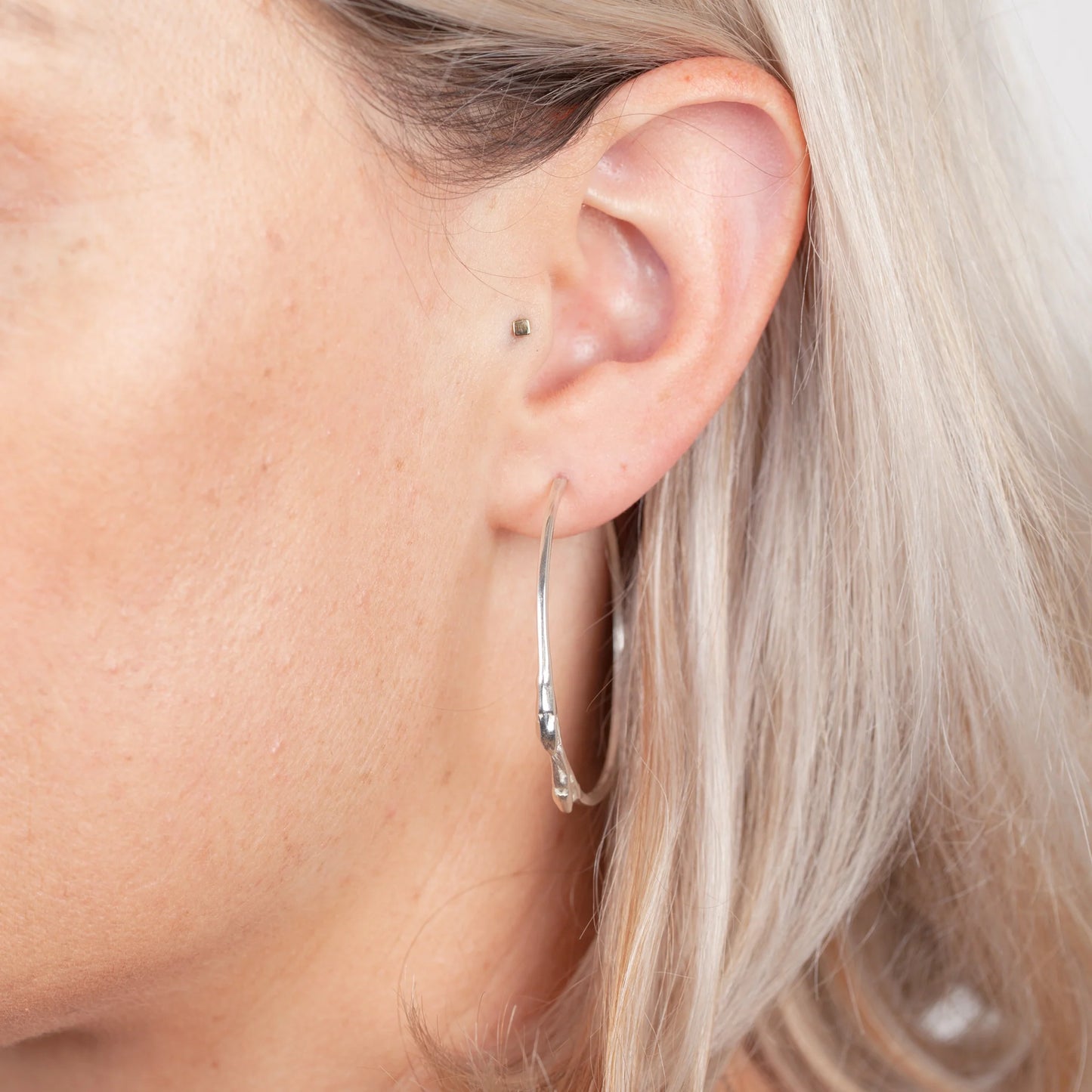 Material: Sterling silver Dimensions: 2.5mm at its widest point, 45mm in diameter Design: Sterling silver cast from twig with a highly polished finish Closure: Friction post Elegant and nature-inspired. Simple Twig Silver Hoop Earrings Kathleen Holland Jewellery