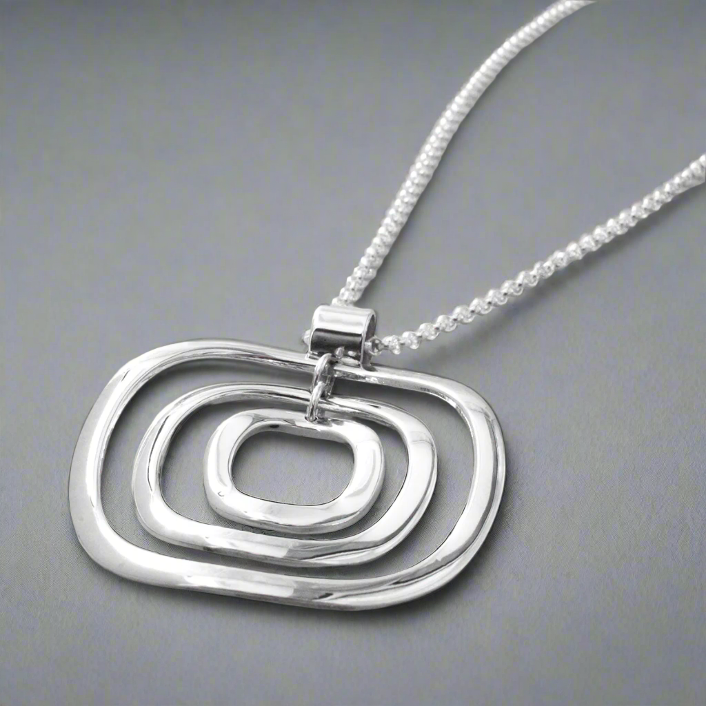 AYA Multi Circle Silver Pendant Silver Ireland Gifts
A striking symbol of timeless elegance, the&nbsp;AYA Multi Circle Silver Pendant is designed to complement any outfit with its sleek, versatile design. Its substantial size and refined craftsmanship make it a standout piece for both daily wear and special occasions.