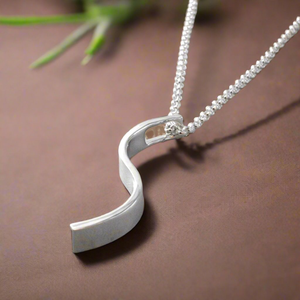 AYA_-_S_Bar_Silver_Pendant_PHP0028.16_6 Ireland jewellery
AYA - S Bar Silver Pendant Curated and designed by Emilio Sotelo Jewelry for Croi Kinsale Jewellery in Kinsale West Cork Ireland Europe. Find exceptional handmade silver and gold jewellery at affordable prices for birthday gifts and Christmas presents. Find Irish designers and makers. Beautiful jewellery shop located in Kinsale, Co. Cork.