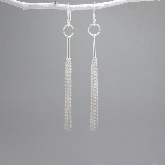 Áine - Tessel Silver Earrings - Dangle  Design: Multi cascading chains on skinny tube, mimicking a tessel Style: Silver Earrings - Dangle Material: Sterling silver Fastening: Sterling silver French wire Length: 85 MM from top of French wire Features: Lightweight, whimsical Measurements: Tube thickness: 1.2 MM Hoop diameter: 9 MM