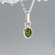 Green peridot is celebrated for its vibrant, energetic hue. Known for its association with positive energy and growth, peridot is believed to bring renewal and clarity to its wearer. Traditionally, this gemstone is valued for its ability to enhance personal power, increase confidence, and offer a sense of well-being. Candy - Green Peridot Silver Pendant. Ireland.