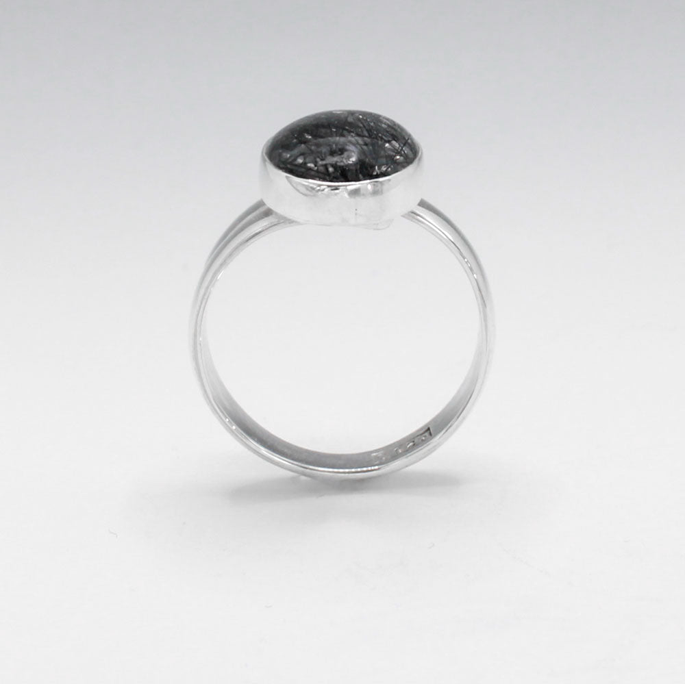 Candy - Oval Tourmalinated Quartz Cabochon Silver Ring - Adjustable. Ireland Jewellery. Tourmalinated Quartz is believed to combine the healing properties of both quartz and tourmaline. It is thought to provide grounding, protection, and balance, while also enhancing clarity and focus.