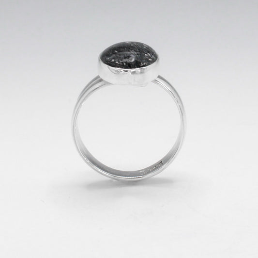 Candy - Oval Tourmalinated Quartz Cabochon Silver Ring - Adjustable. Ireland Jewellery. Tourmalinated Quartz is believed to combine the healing properties of both quartz and tourmaline. It is thought to provide grounding, protection, and balance, while also enhancing clarity and focus.