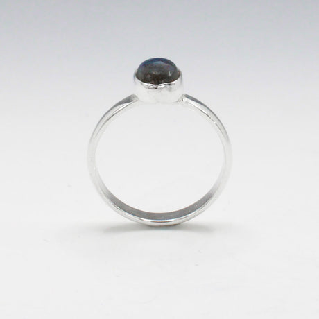 Labradorite is a captivating gemstone known for its unique optical properties. Labradorite is famous for its iridescence, often displaying a stunning play of colours, known as labradorescence. Candy - Small Oval Labradorite Cabochon Silver Ring. Ireland jewellery.