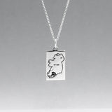 Celebrate Cork with our&nbsp;Eire - Cork &amp; Not Cork Silver Pendant.  Design: Features a map highlighting Co. Cork with a light oxidized finish, contrasting with the rest of Ireland. Dimensions: 13mm wide by 20mm long. Materials: Handmade from sterling silver. Chain: Includes a 1.4mm sterling silver Rolo chain with a spring clasp. Choose your preferred length during checkout.
