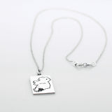Celebrate Cork with our&nbsp;Eire - Cork &amp; Not Cork Silver Pendant.  Design: Features a map highlighting Co. Cork with a light oxidized finish, contrasting with the rest of Ireland. Dimensions: 13mm wide by 20mm long. Materials: Handmade from sterling silver. Chain: Includes a 1.4mm sterling silver Rolo chain with a spring clasp. Choose your preferred length during checkout.