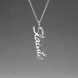 Eire - Sláinte (Health) Silver Pendant  Dimensions: 12mm wide x 37mm long, 1mm thick Chain: 1.7mm sterling silver rolo chain included Material: Made with sterling silver Design: Featuring the word "Sláinte" in italic font Style: Unisex Celebrate health and well-being with our elegant Eire - Sláinte Silver Pendant. This beautifully crafted piece is perfect for anyone who appreciates fine Irish jewellery. Select chain length below.