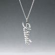 Eire - Sláinte (Health) Silver Pendant  Dimensions: 12mm wide x 37mm long, 1mm thick Chain: 1.7mm sterling silver rolo chain included Material: Made with sterling silver Design: Featuring the word "Sláinte" in italic font Style: Unisex Celebrate health and well-being with our elegant Eire - Sláinte Silver Pendant. This beautifully crafted piece is perfect for anyone who appreciates fine Irish jewellery. Select chain length below.