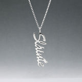 Eire - Sláinte (Health) Silver Pendant  Dimensions: 12mm wide x 37mm long, 1mm thick Chain: 1.7mm sterling silver rolo chain included Material: Made with sterling silver Design: Featuring the word "Sláinte" in italic font Style: Unisex Celebrate health and well-being with our elegant Eire - Sláinte Silver Pendant. This beautifully crafted piece is perfect for anyone who appreciates fine Irish jewellery. Select chain length below.