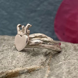 Design: Organic Claddagh inspired by twigs and Irish coral Material: Solid sterling silver Finish: Highly polished Band: 4.5mm at the widest point Centre: Heart and crown measure 13mm long A beautifully crafted piece that blends tradition with nature’s elegance. Perfect for expressing love, loyalty, and friendship.