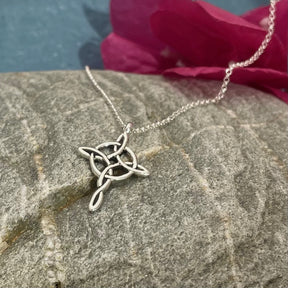 Celtic Knot Cross Silver Pendant Dimensions: 16mm wide by 25mm from the top of the bail Material: .950 sterling silver with a high polished finish and light oxidization Chain: 1.4mm sterling silver belcher rolo chain with a spring clasp Length: Select your preferred chain length below A timeless piece that beautifully captures the spirit of Celtic tradition.