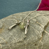 Double Silver Coral Twigs Pendant with Faceted Green Tourmaline and Freshwater Pearl  Twigs: Each measures 6mm at its widest point, and 29mm long, silver casted with a light oxidized finish Charm: Faceted green tourmaline and freshwater pearl, 7mm at its widest point, and 17mm long Chain: Sterling silver rolo chain included, select your preferred length below. Kathleen Holland Jewellry