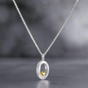 Celebrate life’s most treasured connections with this stunning pendant, featuring a Óir 9K Yellow golden heart nestled in textured sterling silver. Designed to capture the essence of love and care, this piece offers a modern take on meaningful Irish jewellery. Garrett Mallon - Embrace Heart Silver and Gold Pendant.
