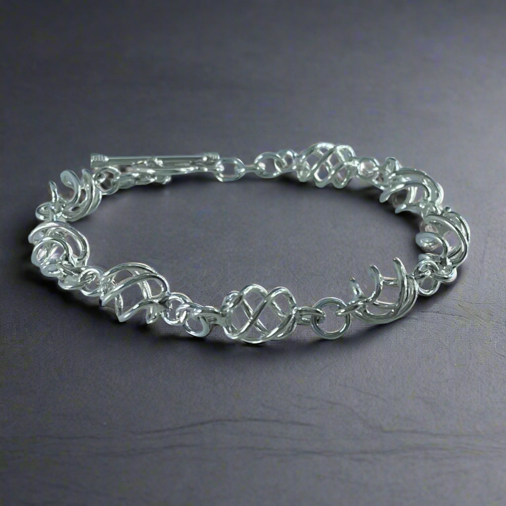 Áine - Sculpted Spiral Link Silver Bracelet