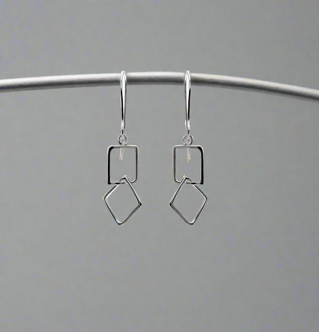 Le Chéile Square Linked Silver Earrings - Dangle by Miriam Wade Jewellery. #LeCheileEarrings #SquareLinkEarrings #SilverJewellery #HandmadeJewellery #IrishDesign #IndependentJewellers #CroíKinsaleJewellery #WestCorkJewellery #Kinsale #JewelleryIreland