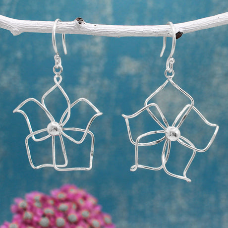 Moineir - Fiesta Plumeria Silver Earrings - Dangle  Diameter: 37 MM Length: 48 MM from the top of the French wire Features: Lightweight, highly polished silver Fastening: Sterling silver French wire Style: Perfect for summer