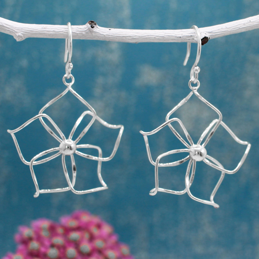 Moineir - Fiesta Plumeria Silver Earrings - Dangle  Diameter: 37 MM Length: 48 MM from the top of the French wire Features: Lightweight, highly polished silver Fastening: Sterling silver French wire Style: Perfect for summer